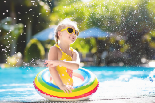 Toddler playng in pool