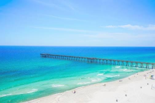 Aerial view of ocean and fishing pier