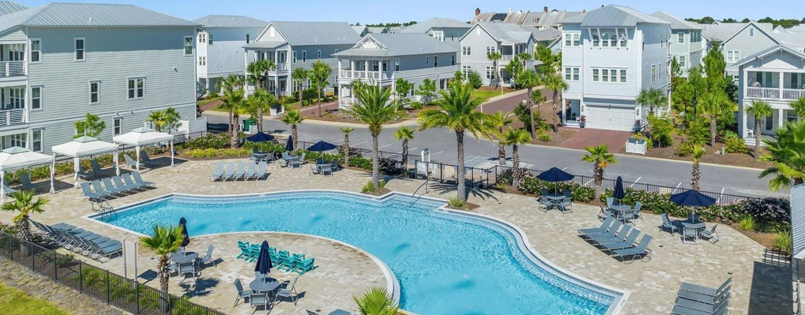 Aerial view of community pool and lounge chairs