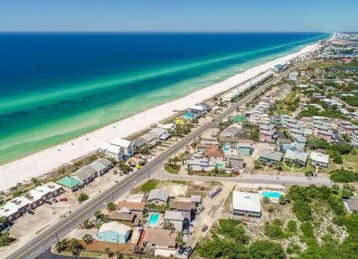 Aerial view of houses along coastline